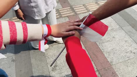 stacking hands to celebrate indonesia independence day