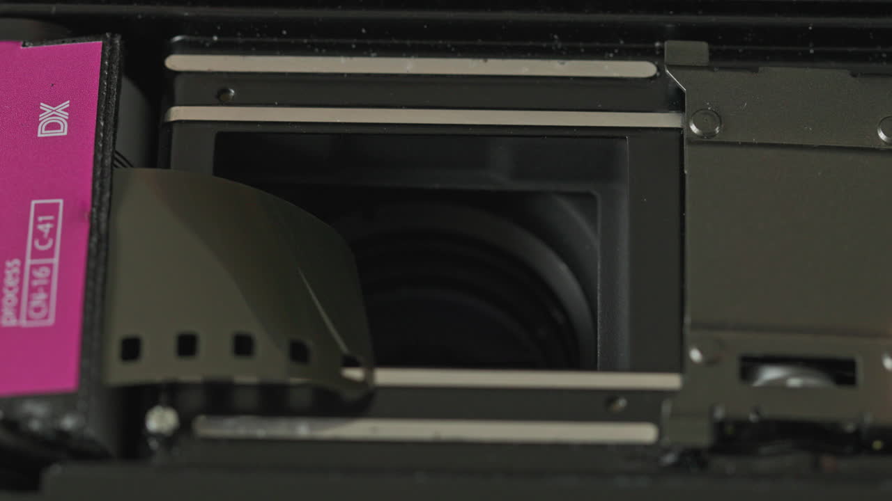 Close-up of 35mm Film Cartridge in a Camera