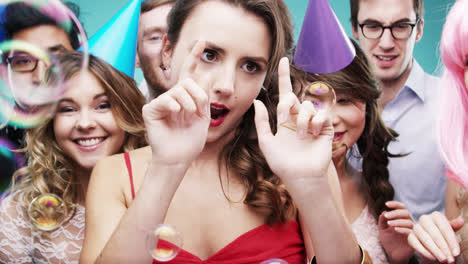 Multi-racial-group-of-happy-people-dancing-with-bubbles-slow-motion-party-photo-booth