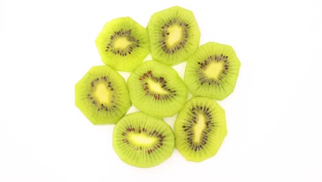 fresh slices of kiwi fruit rotating - stop motion