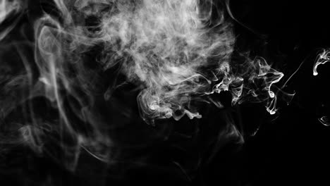 Slow-motion-wispy-smoke-cloud-swirls-around-the-shot,-mostly-filling-the-top-of-the-frame