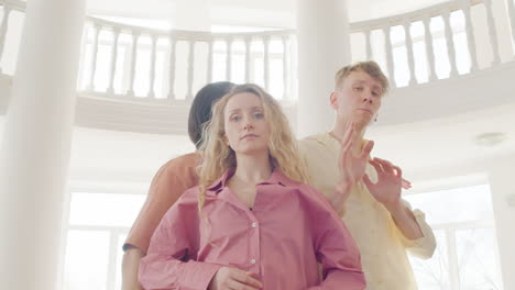 Close-Up-View-Fo-Multiethnic-Group-Of-Contemporary-Dancers-Dancing-And-Looking-At-Camera-In-The-Studio