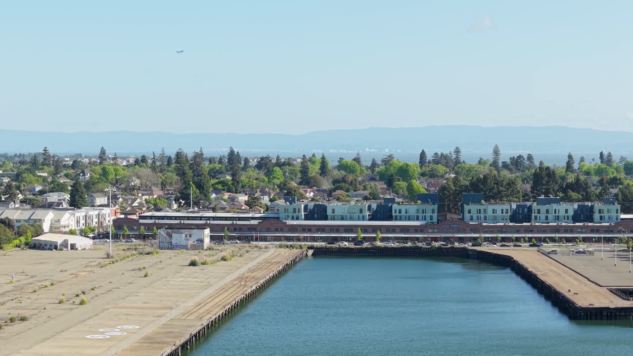 A static aerial view of an Alameda neighborhood of Mariner Square in the late afternoon.