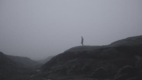 silhouette in abandoned icelandic canyon in a foggy, moody, dramatic landscape