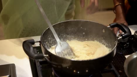 making shira indian sweet for pooja rituals and added some milk