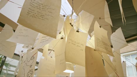 written poems hanging installation art. low angle