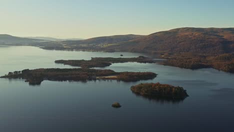 beautiful islands in the lake of loch lomond and the trossachs national park from an aerial drone during autumn in scotland