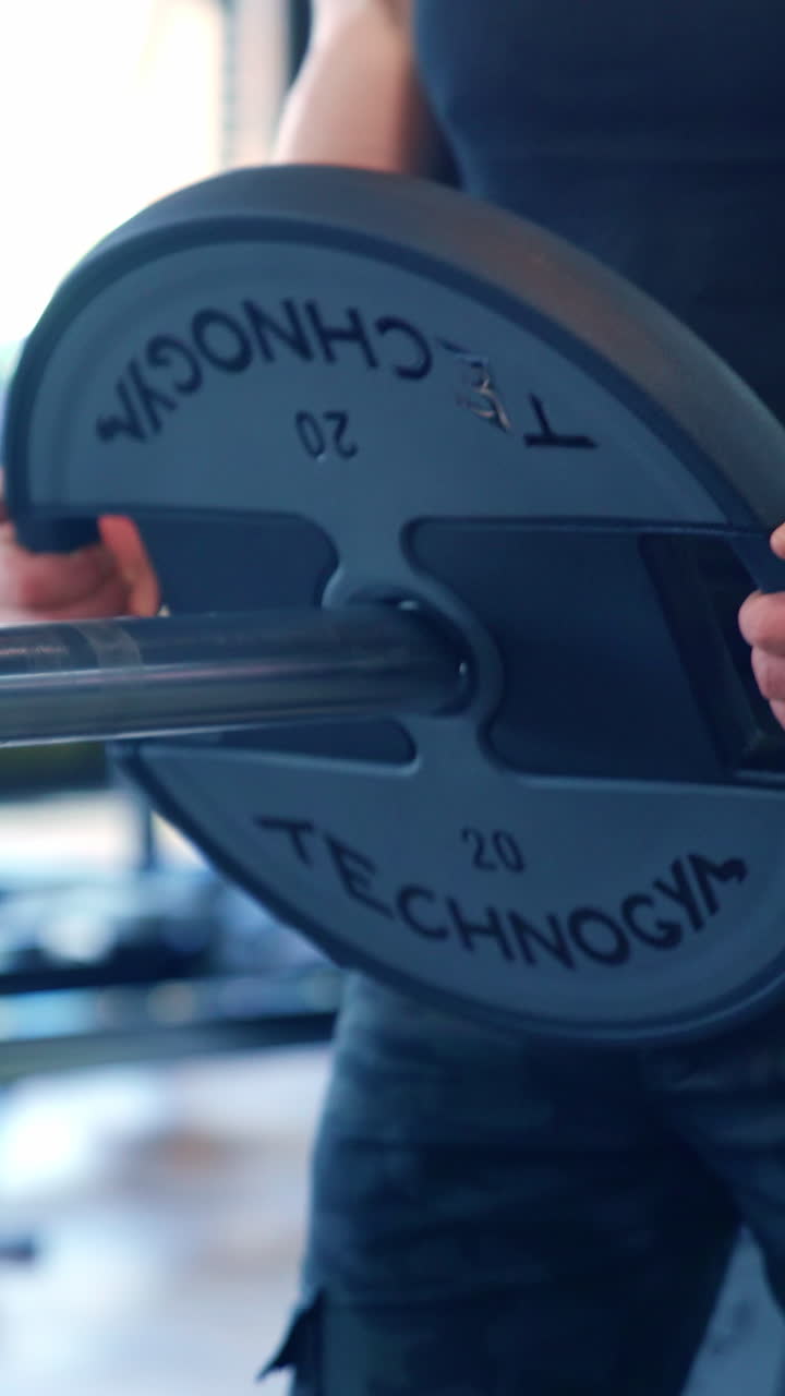 Young Man Working Out At Gym