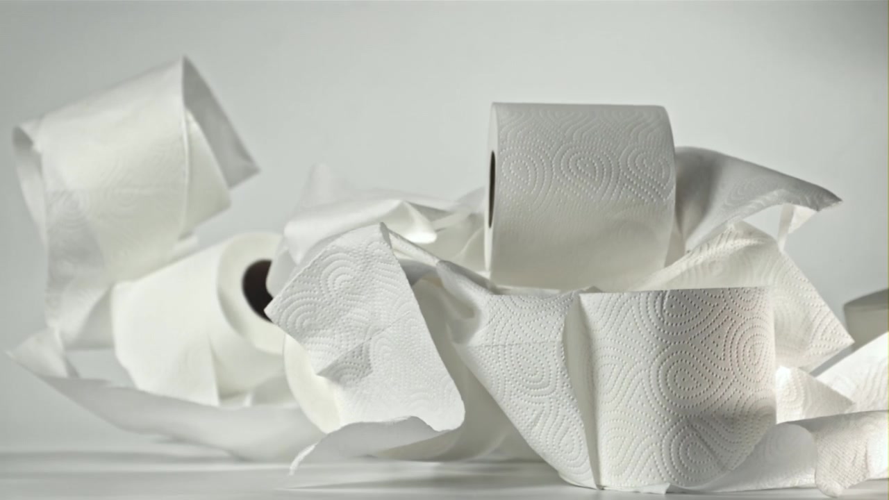 Multiple Rolls of Toilet Paper Falling in Slow Motion