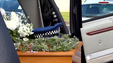 closeup shot of a funeral casket in a hearse or chapel or burial at cemetery