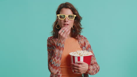 woman in 3d glasses eating popcorn and watching interesting tv serial sport game film online movie