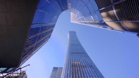 looking up at the high-rise buildings in the city