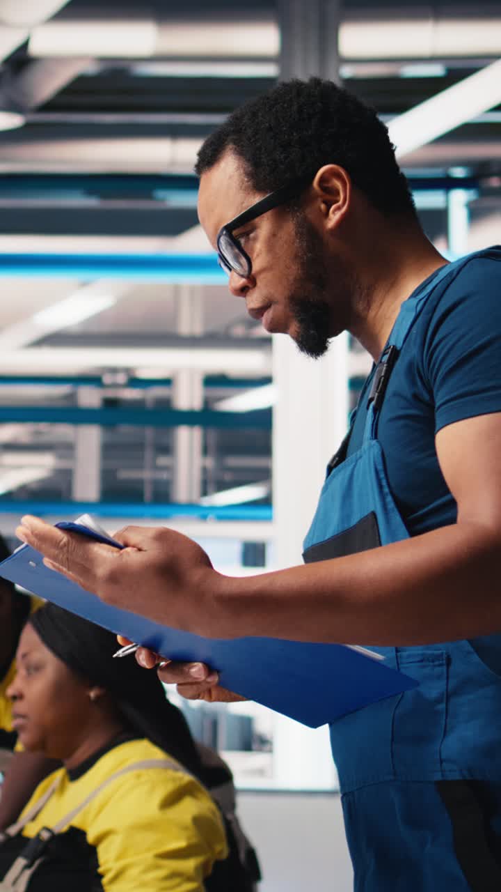 Vertical Video Supervisor in solar panel factory investigating potential malfunctioning systems