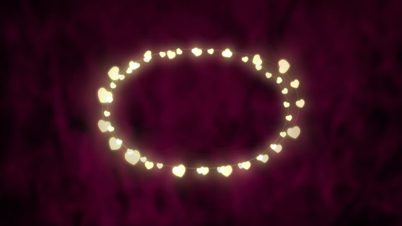 un óvalo brillante de luces de hadas sobre un fondo rosa