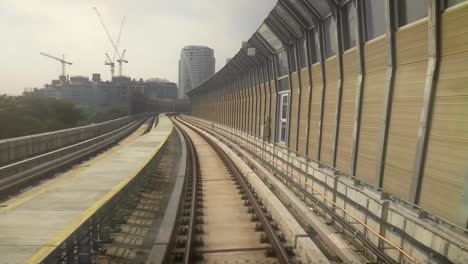 kuala lumpur, malaysia -july 8, 2019: passengers record the mass rapid transit movement from the back of the train