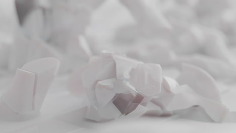 crushed android shells on spikes on a foggy, white junkyard