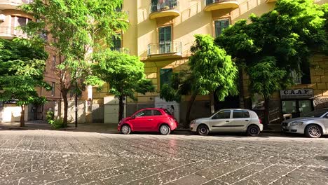 street view of a building with parked cars