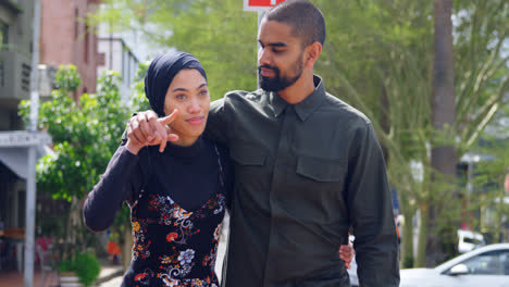 young couple walking on street 4k