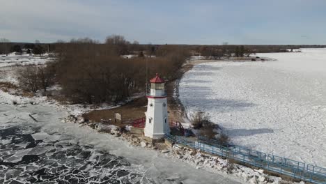 4k drone video of cheboygan, michigan lighthouse in winter