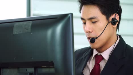 Business-people-wearing-headset-working-in-office