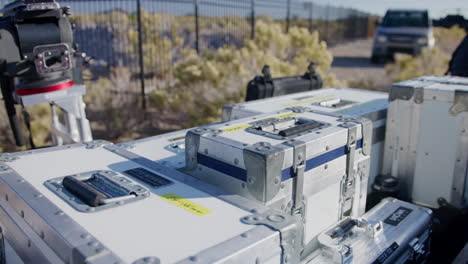 Cinema-lens-cases-are-stacked-on-a-camera-cart-on-film-set