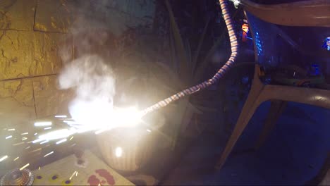 boy burning firework or cracker during the diwali festival celebration in india