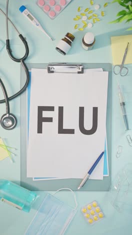 VERTICAL-VIDEO-OF-FLU-WRITTEN-ON-MEDICAL-PAPER