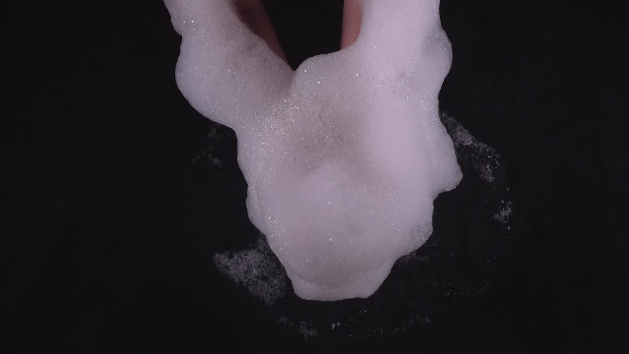 Foam making by hand, a close-up view