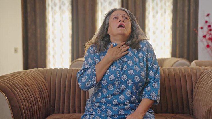Aged Indian woman having Asthma attack