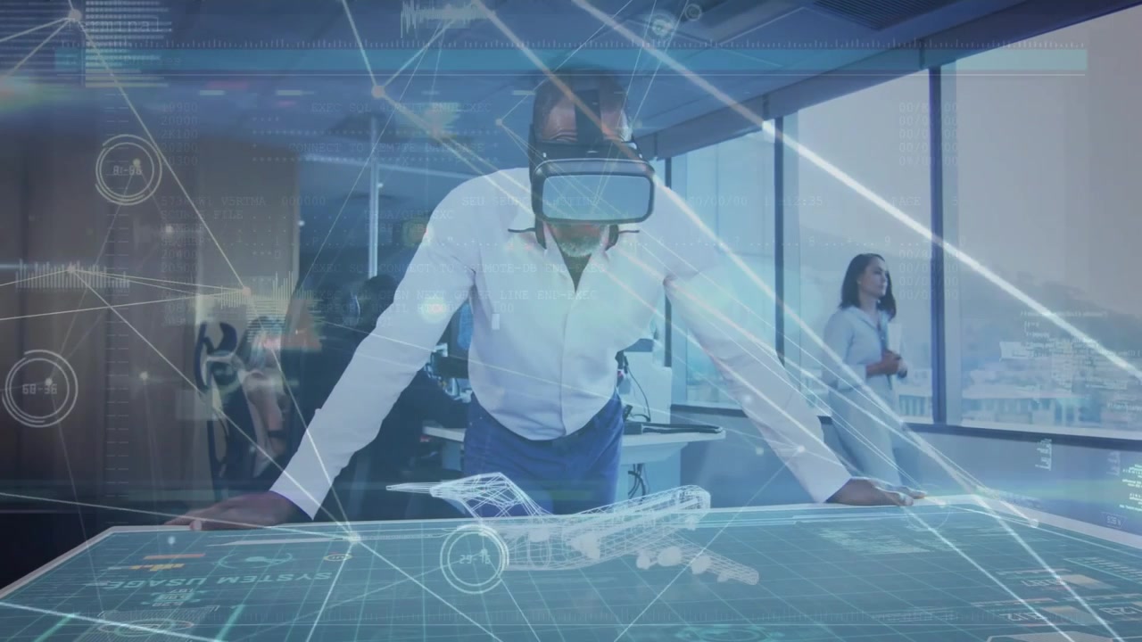 Senior man using VR headset on table, activating aircraft model for demo while colleague watching