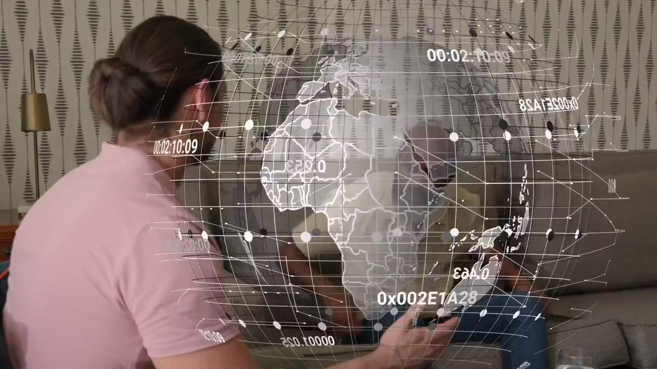 Man in pink shirt initiating discussion, two men reviewing tech data, planning as globe overlaying