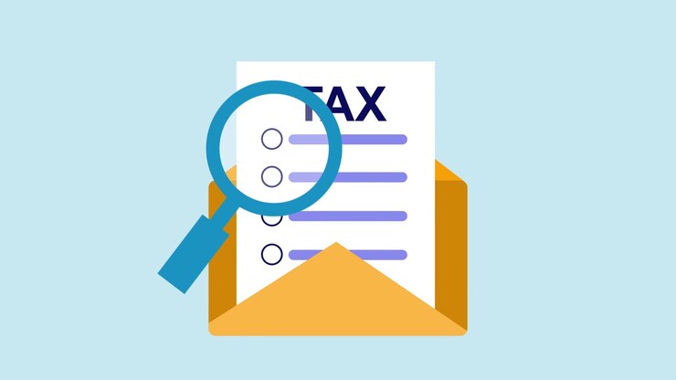 Magnifying Glass Examining Tax Document in Envelope