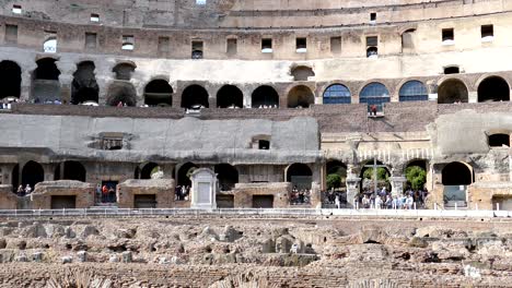 arena coliseum at evening time, with tourists inside