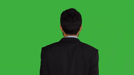 young asian man isolated on green screen background. portrait of businessman representing business strategy ideas. professional lifestyle shot.