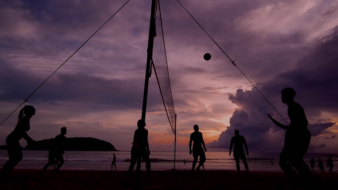 Silhouetted Beach Volleyball at Sunset