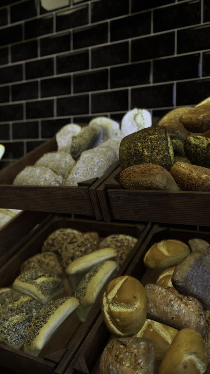 Freshly baked artisanal bread displayed in wooden crates in a bakery