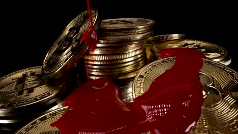 red paint dropping over golden bitcoins symbolic of blood-red day in crypto markets, 4k cryptocurrency