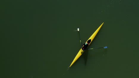 aerial view of a crew boat rowing on a lake