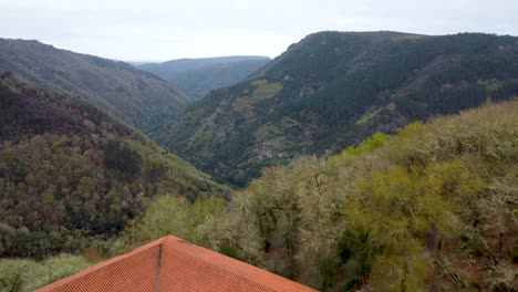 Beautiful-Spanish-monastery-overlooks-lush-green-valley-in-Ourense-Spain