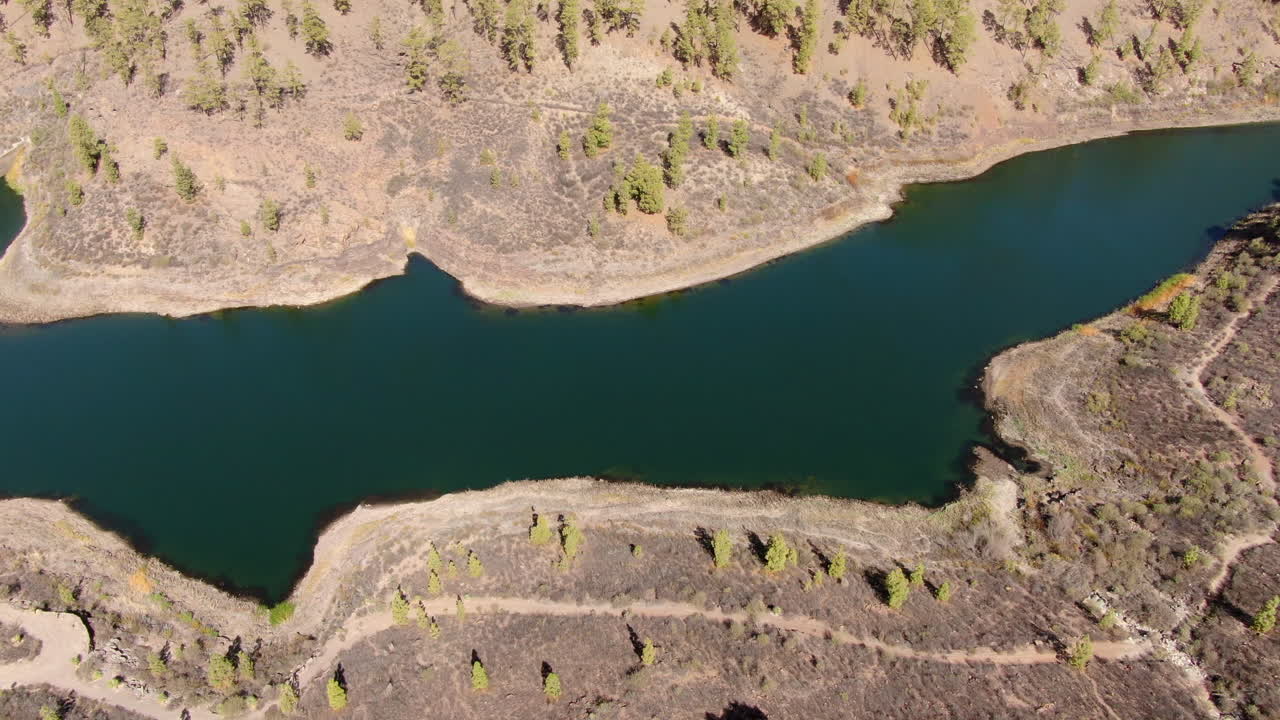 Breathtaking aerial perspective of El Mulato Dam nestled in the arid landscape of Gran Canaria