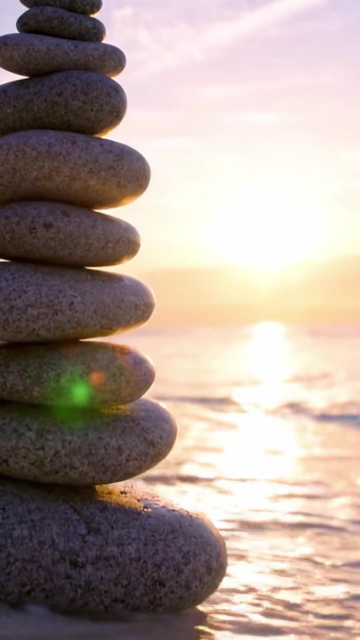 A Serene Sunset Stacked Stones on a Beach: Capturing Tranquility and Balance in Nature's Beautiful Landscape