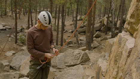 Climber-at-the-bottom-of-the-cliff