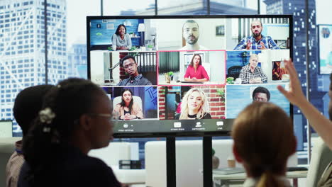 company employees attending a meeting via videocall with investors