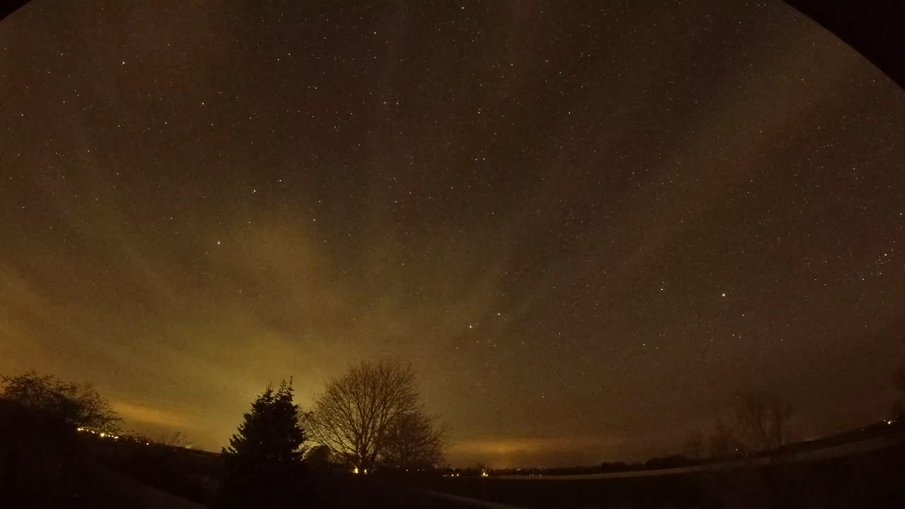 Nightlapse of the stars and clouds. 
Lights from cars driving by.