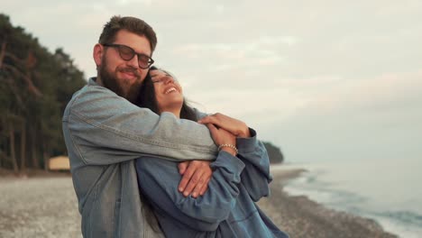 couple hugging on the beach