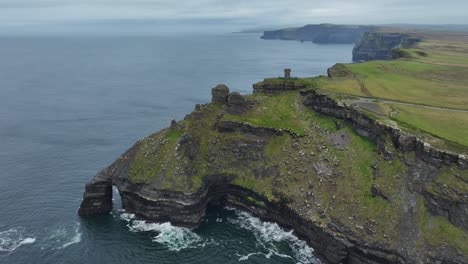 Drone-weather-of-Ireland-static-shot-Cliffs-of-Moher-sea-caves-wild-water-and-enchanting-views-Ireland-in-November-winter-days