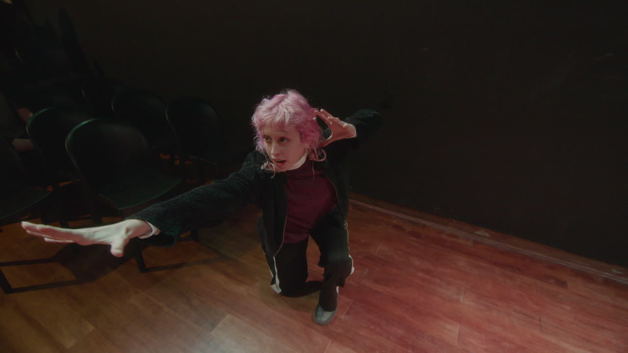 Young Actress Performing on Theater Stage during Rehearsal