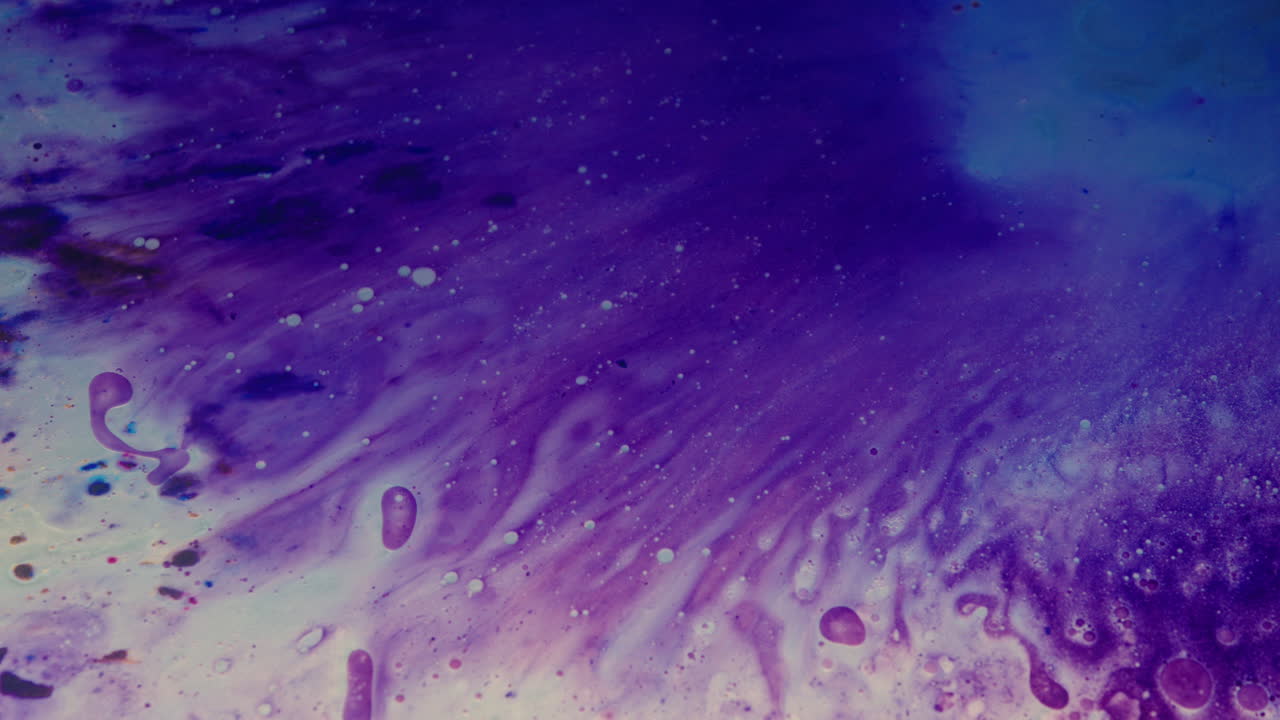 Colourful, organic, liquids macro shots buzzing and flowing