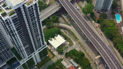 aerial birds eye view drone capturing high rise condominium, urban development of inner city suburbs and overpass and underpass traffics, seputeh, selangor, kuala lumpur, malaysia