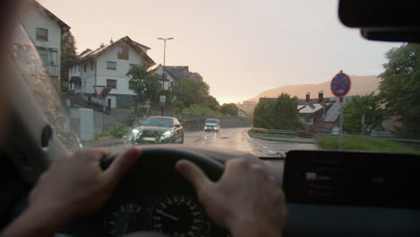 driving through a scenic village at sunset